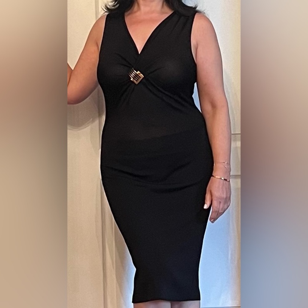 Gucci gorgeous cocktail black dress with gold brooch. Size M in as new condition